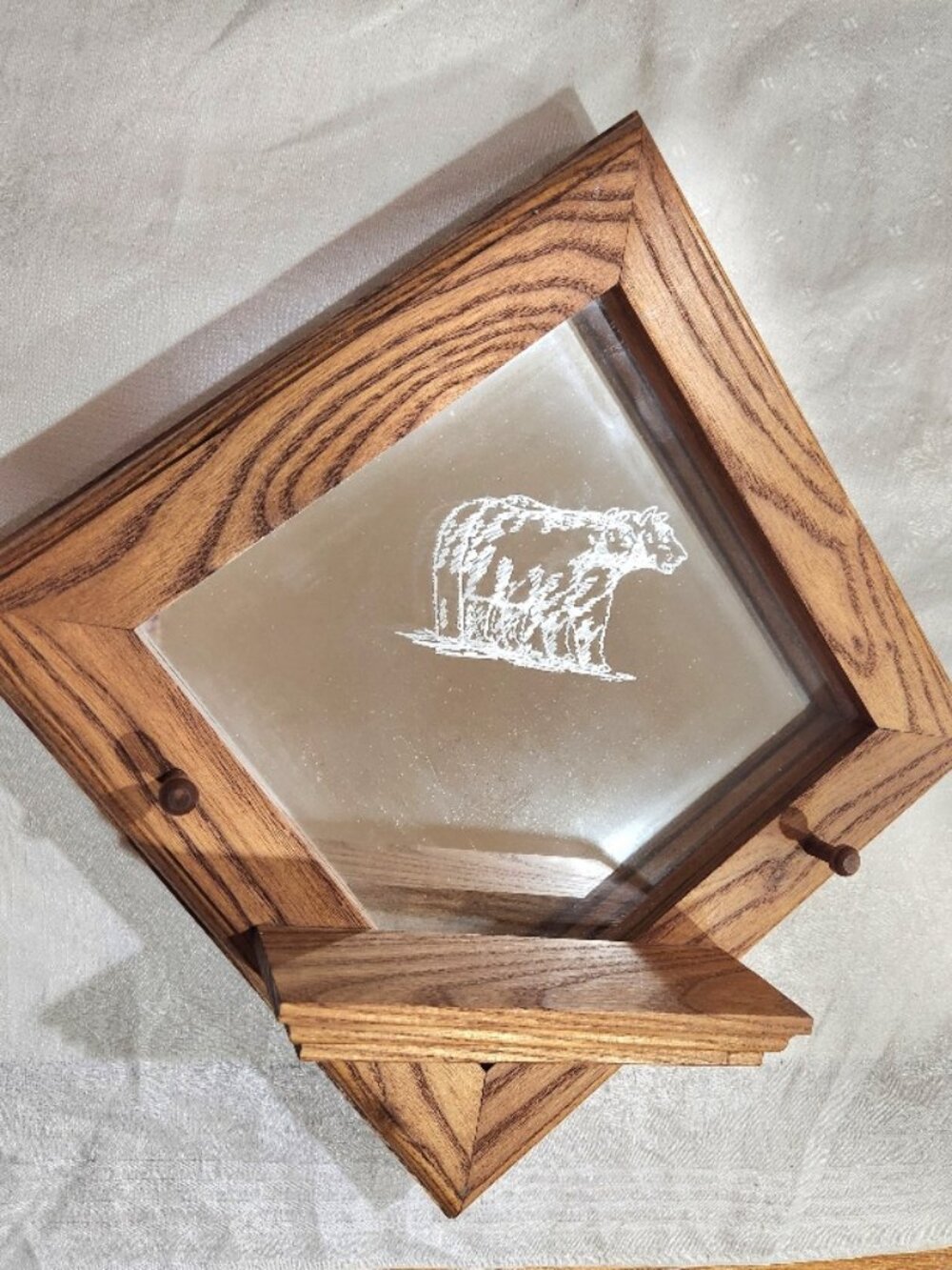 Quality Oak Mirrored Shelf w/2 pegs and an etched bear on the mirror.